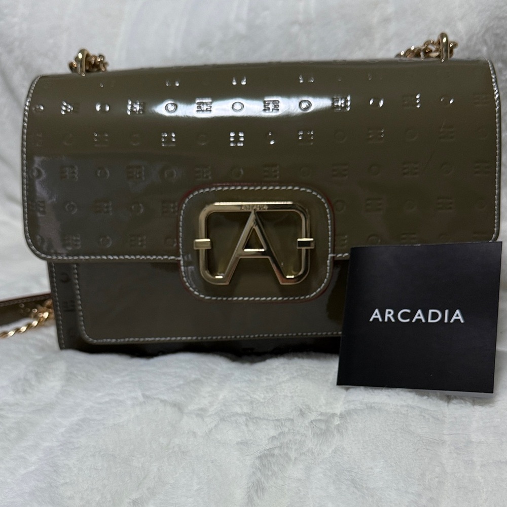 Arcadia patent leather crossbody chain bag in “Vegetale” olive green. NWT